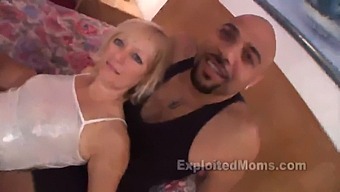 A Mature Blonde Woman Engages In Sexual Activity With An Inexperienced Partner Who Possesses A Large Black Penis, As Seen In A Steamy Video